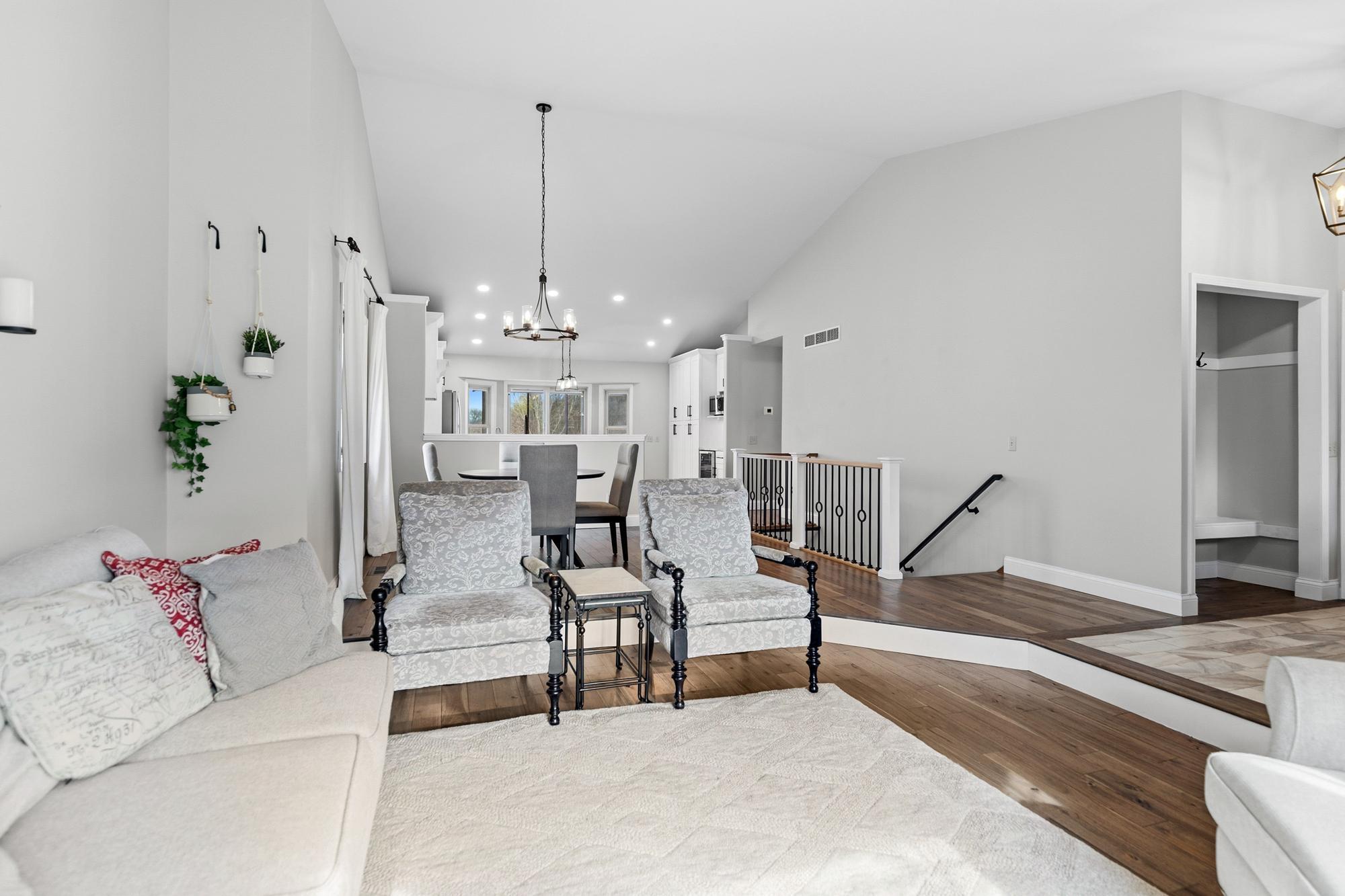 To the right, in this photo, is the entryway from both the street and attached garage. The front closet has been converted into a mini drop zone complete with a built-in bench to ease the process of getting boots off and on.