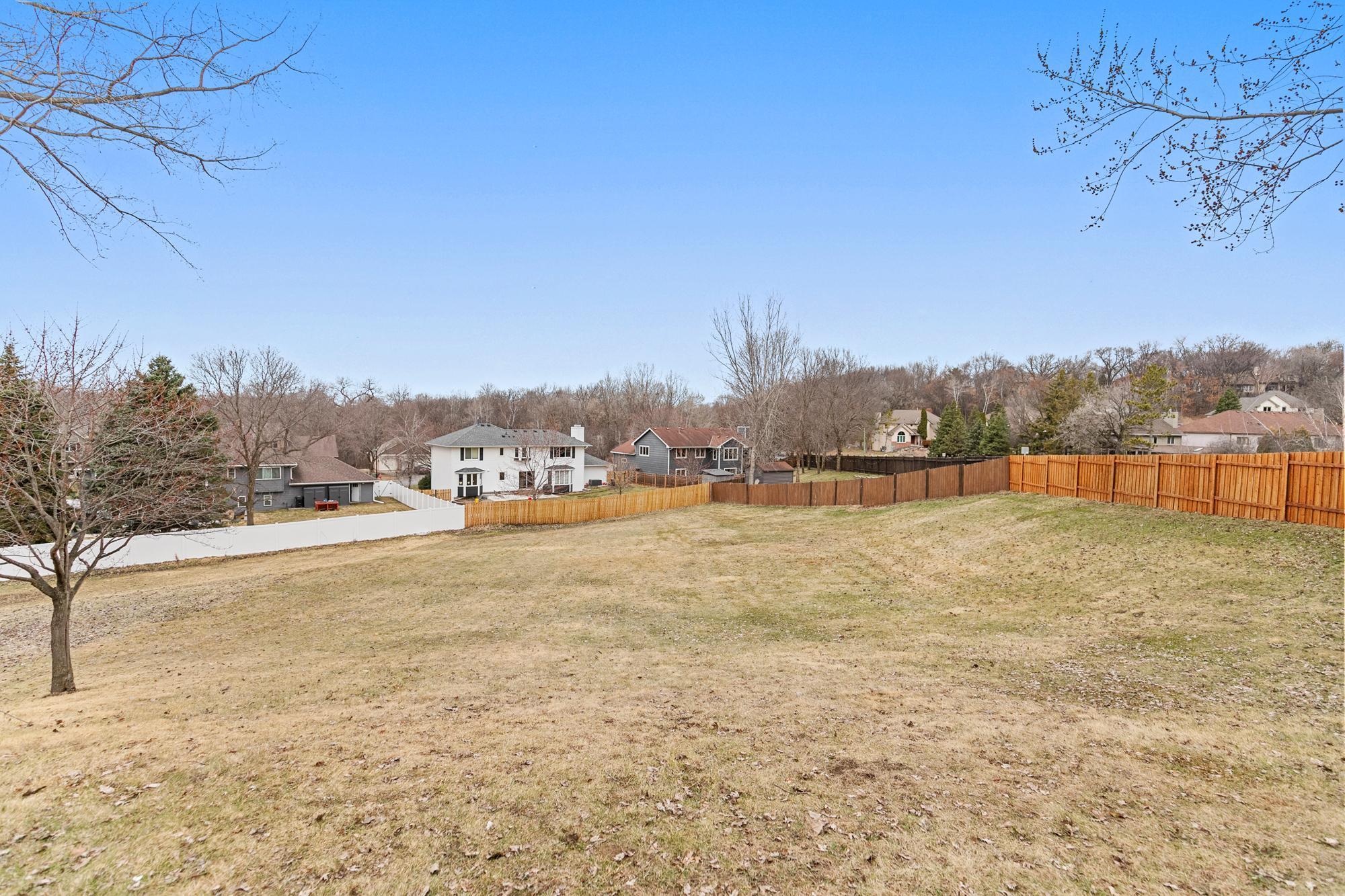 Neighboring fences enclose all of the back yard. The only area unfenced is just the south/southwest side.