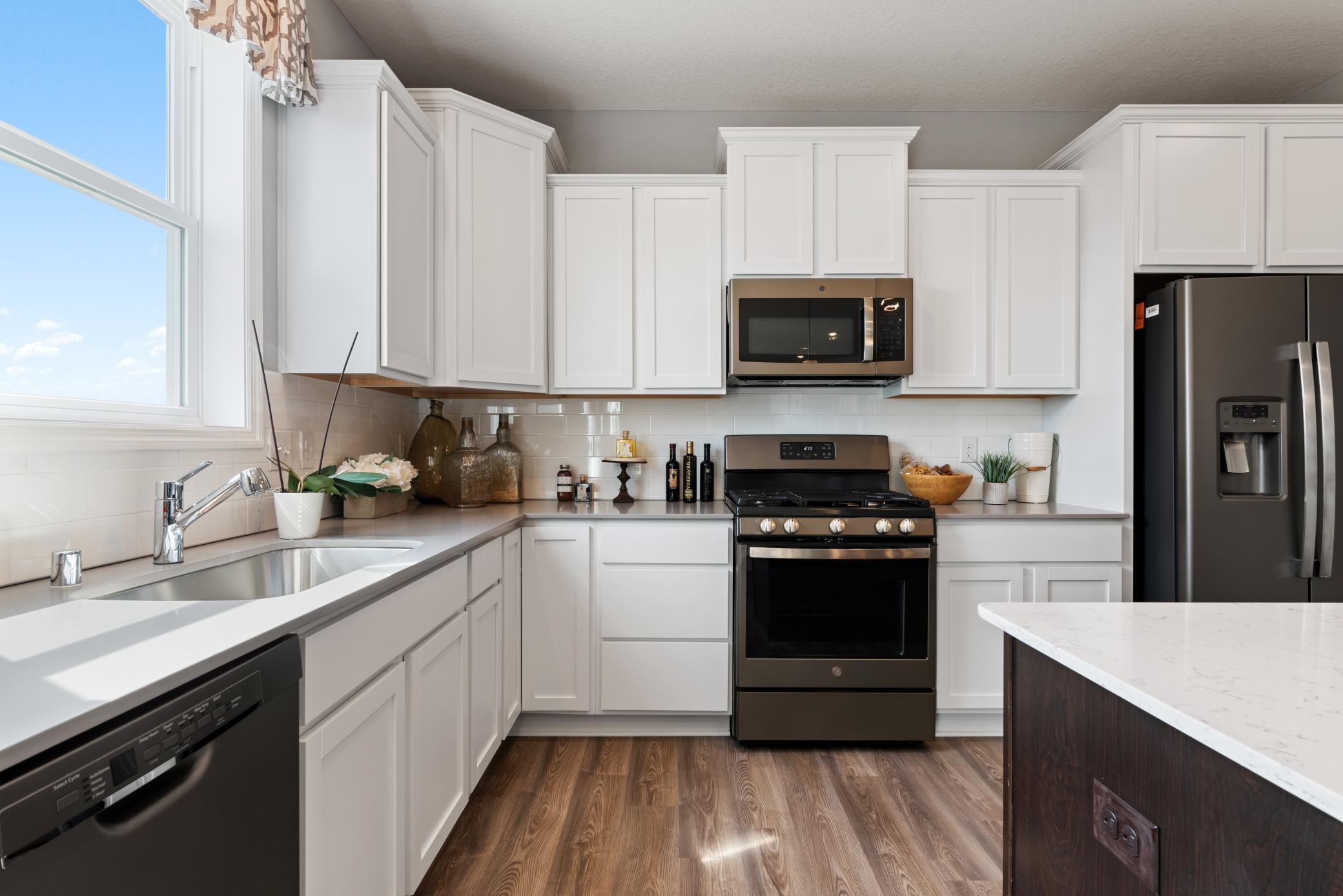 (Photo of decorated model, colors and features will vary) All stainless steal kitchen appliances come included with Lennar's Everything's Included package!