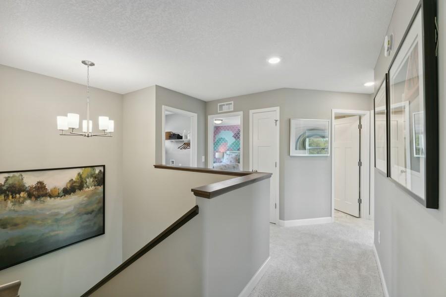 (Photo of decorated model, colors and features will vary) Upper level with half wall for space definition and an open feel. Two linen closets are included on the upper level - fantastic storage!