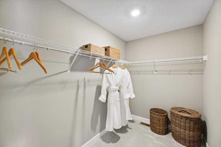 (Photo of decorated model, colors and features will vary) Massive walk in closet features breathable shelving and opportunity for customization.