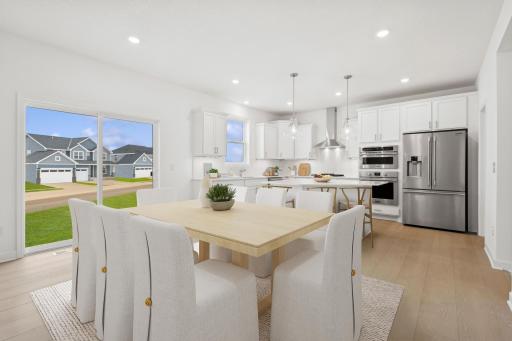 (Photo of model home, features will vary) Enjoy meals of any kind in the dining room, situated among the open floorplan for effortless flow between cooking, dining and relaxing.