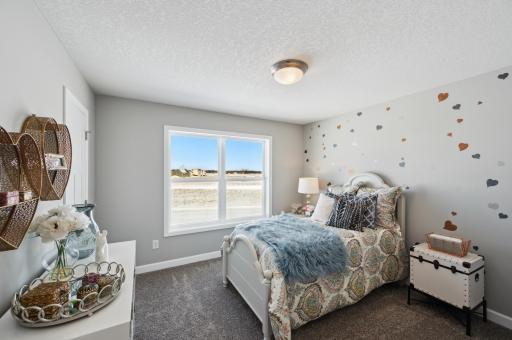 (Photo of model home, features will vary) Three secondary bedrooms can be found upstairs, just down the hall from the ownerâs suite.