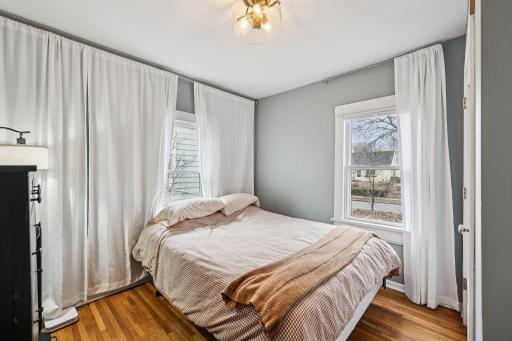 Main level bedroom with attached 1/2 bath