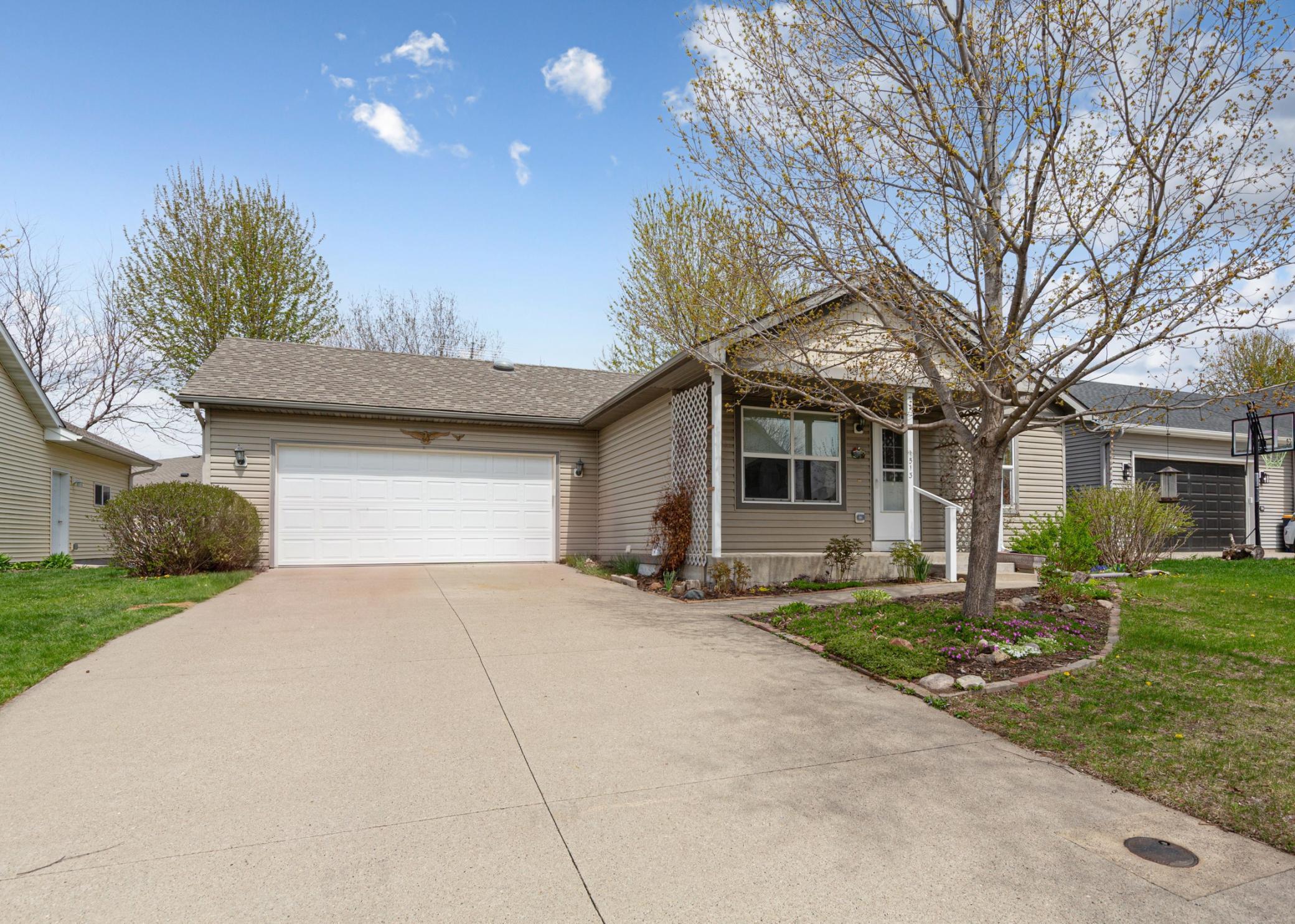 Attached 2 car garage and South facing cement driveway
