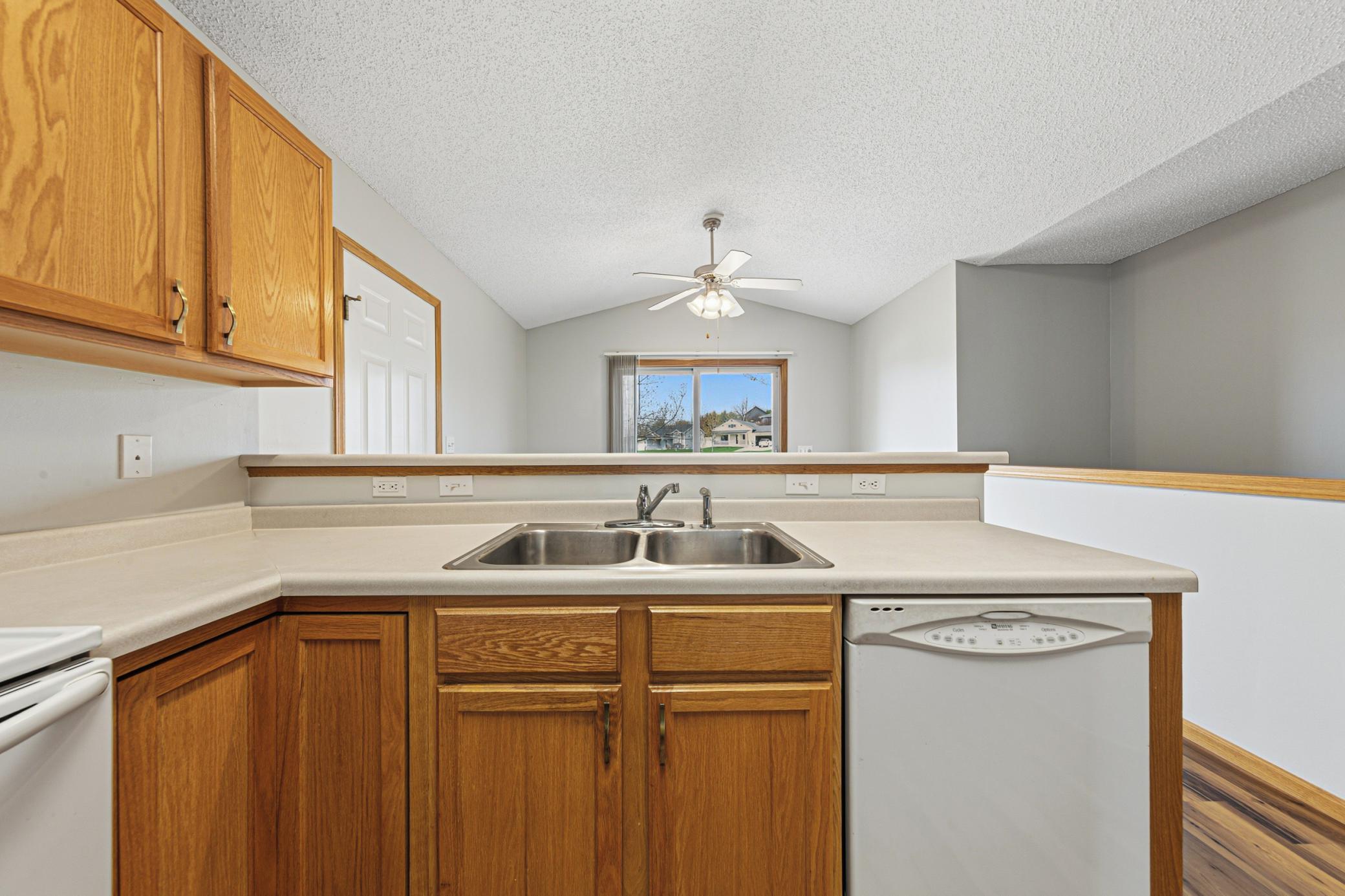 Kitchen opens to the dining area and has a view of the backyard