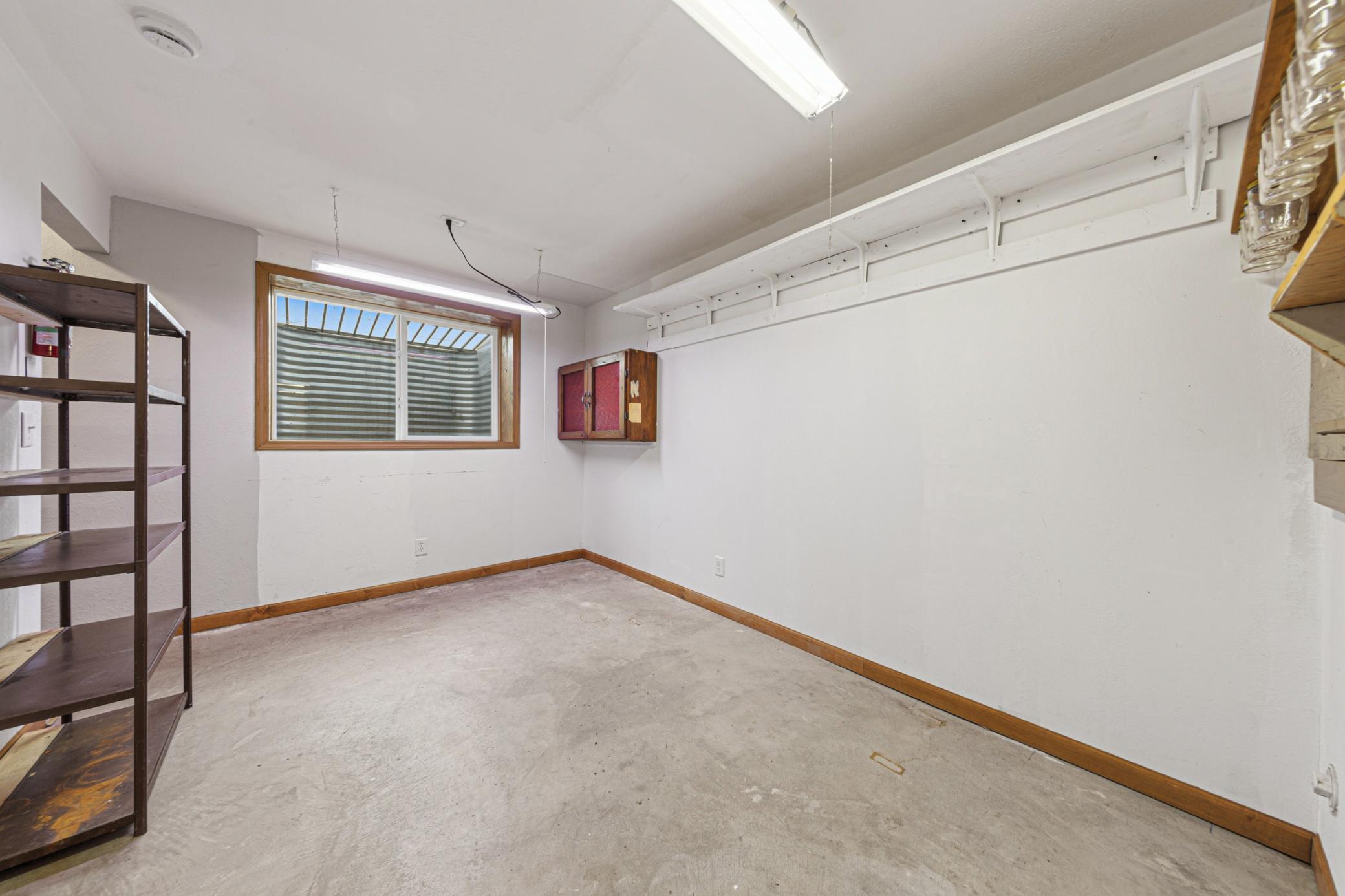 Workshop area. Egress window could be used to make this a 4th bedroom