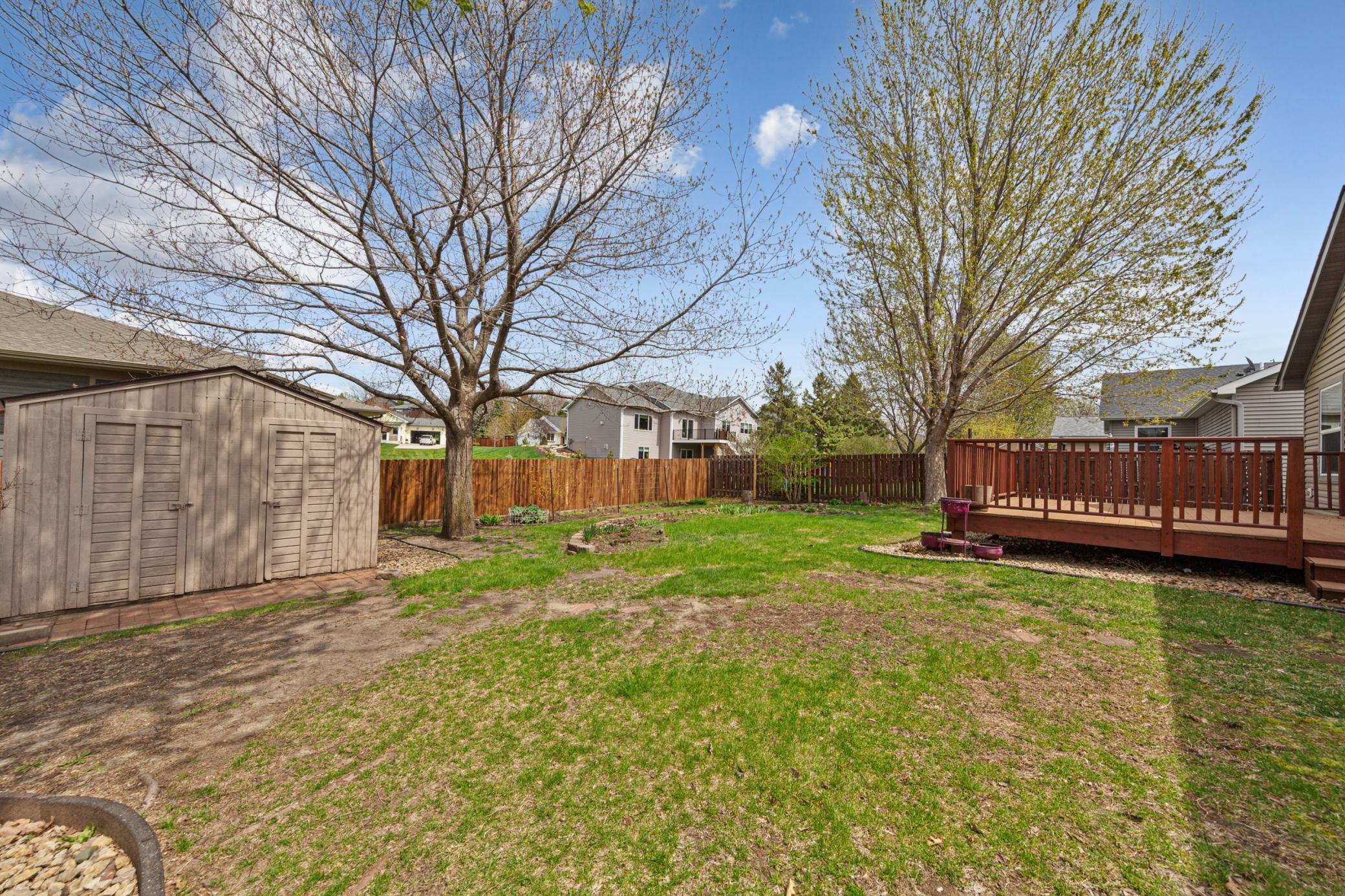 12x10 garden shed and partially fenced backyard