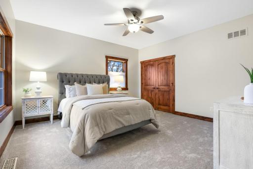 Three additional spacious upper-level bedrooms provide flexibility for guests, home office space, or hobbies.