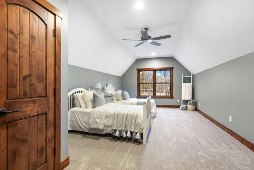 Each bedroom features plush carpeting, ceiling fans, 9-foot ceilings, and ample closet space.