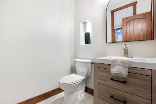 A stylish 1/2 bath completes the level.