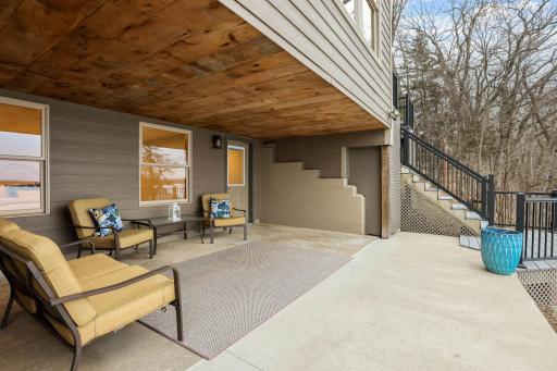 Step outside to an expansive covered patio designed for both relaxation and entertaining, complete with a gas line for grilling and uninterrupted lake views.