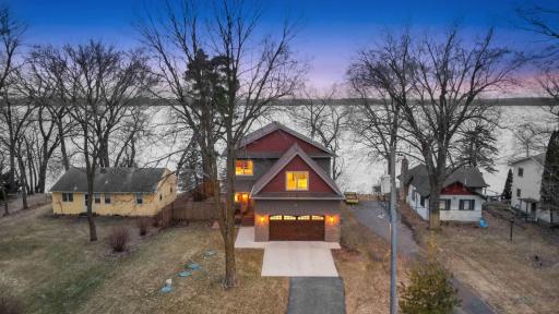 The insulated and finished two-car garage ensures year-round comfort, while the boathouse, a feature no longer permitted to be built, adds exceptional value. Endless opportunities to relax, entertain, and take in the beauty of Clearwater Lake!