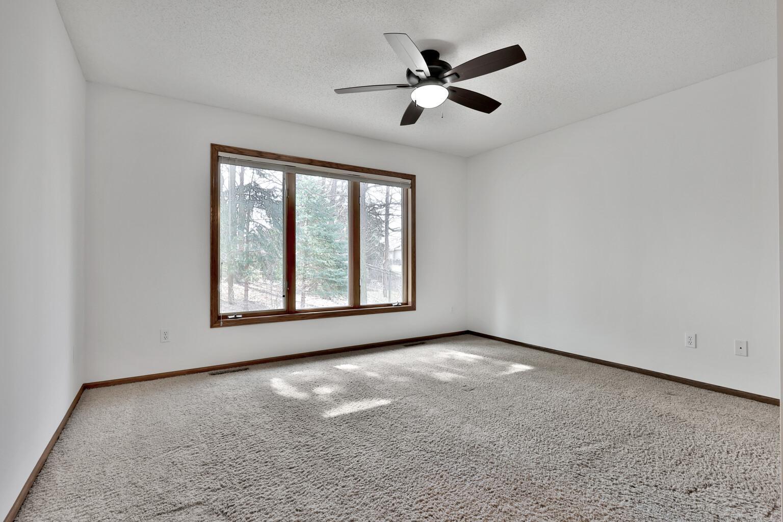 Great sized primary with large windows for views of the private backyard