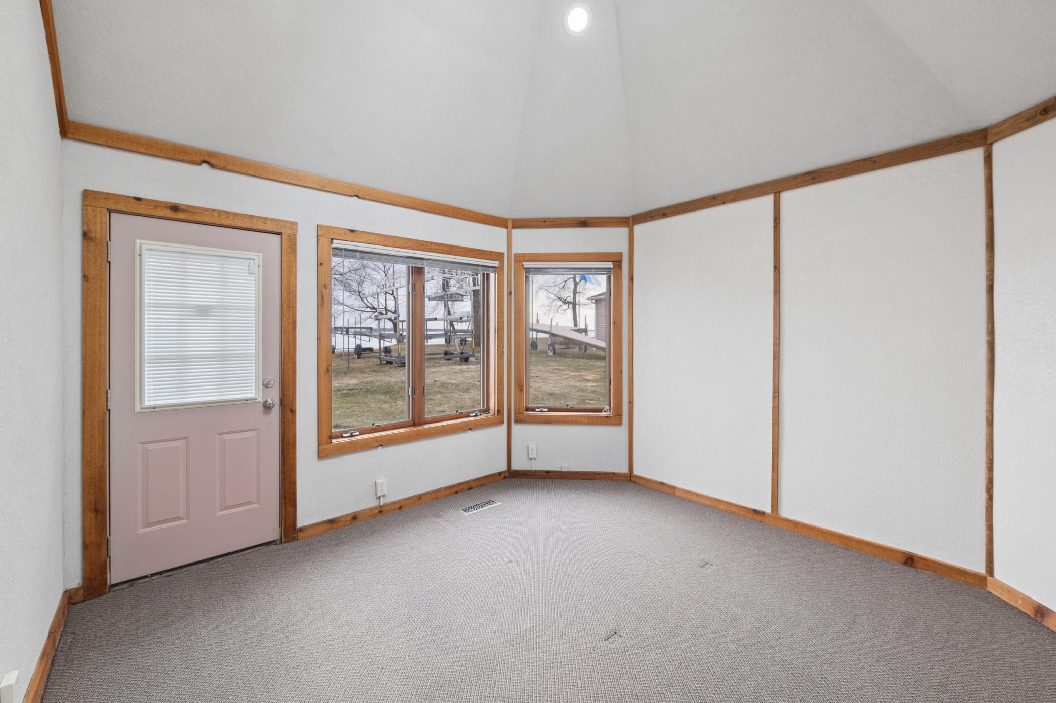 Main level flex room / lakeside - home office with a view or could be additional sleeping space.