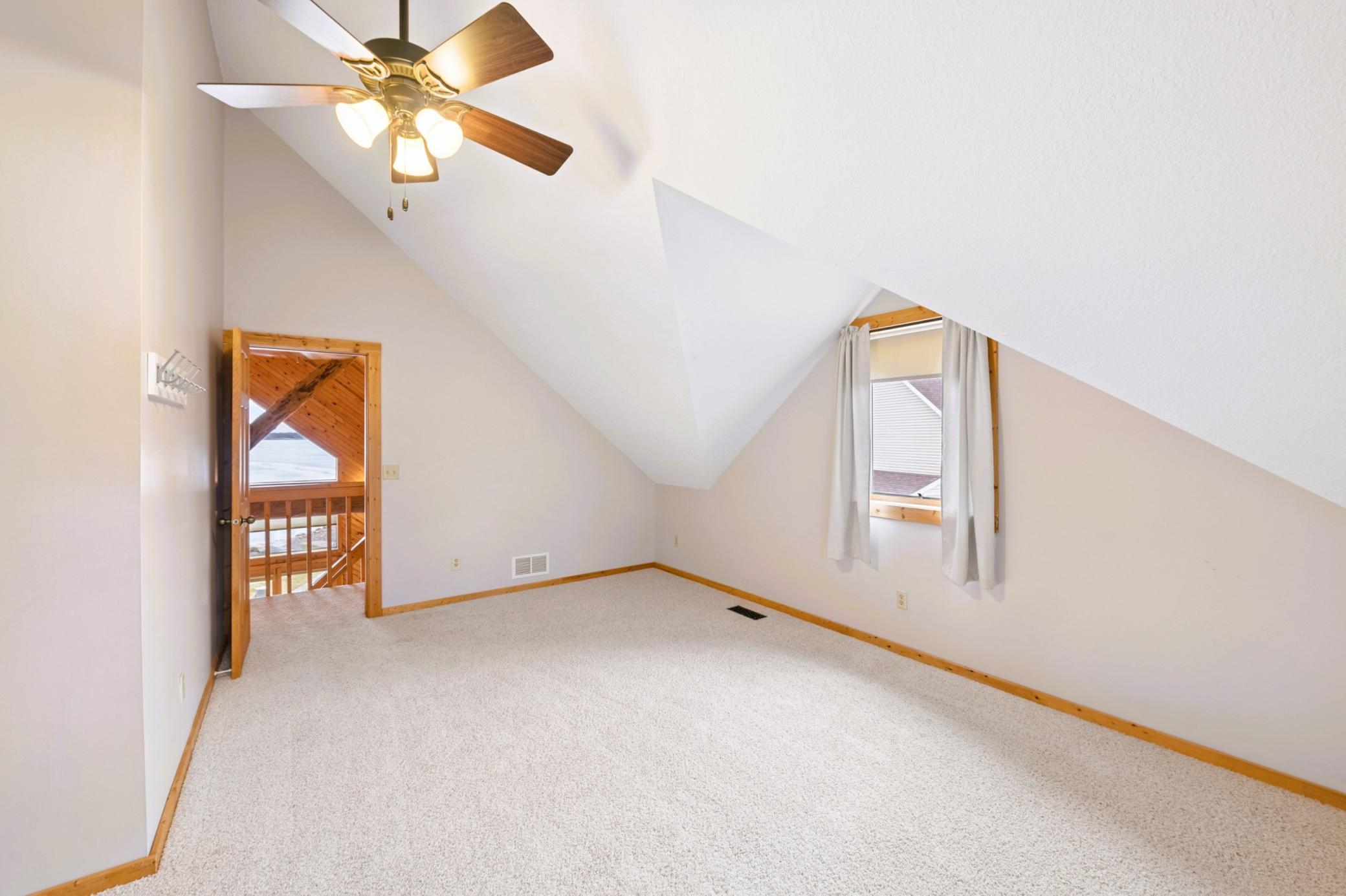 Large bedroom 2 vaulted high ceilings.