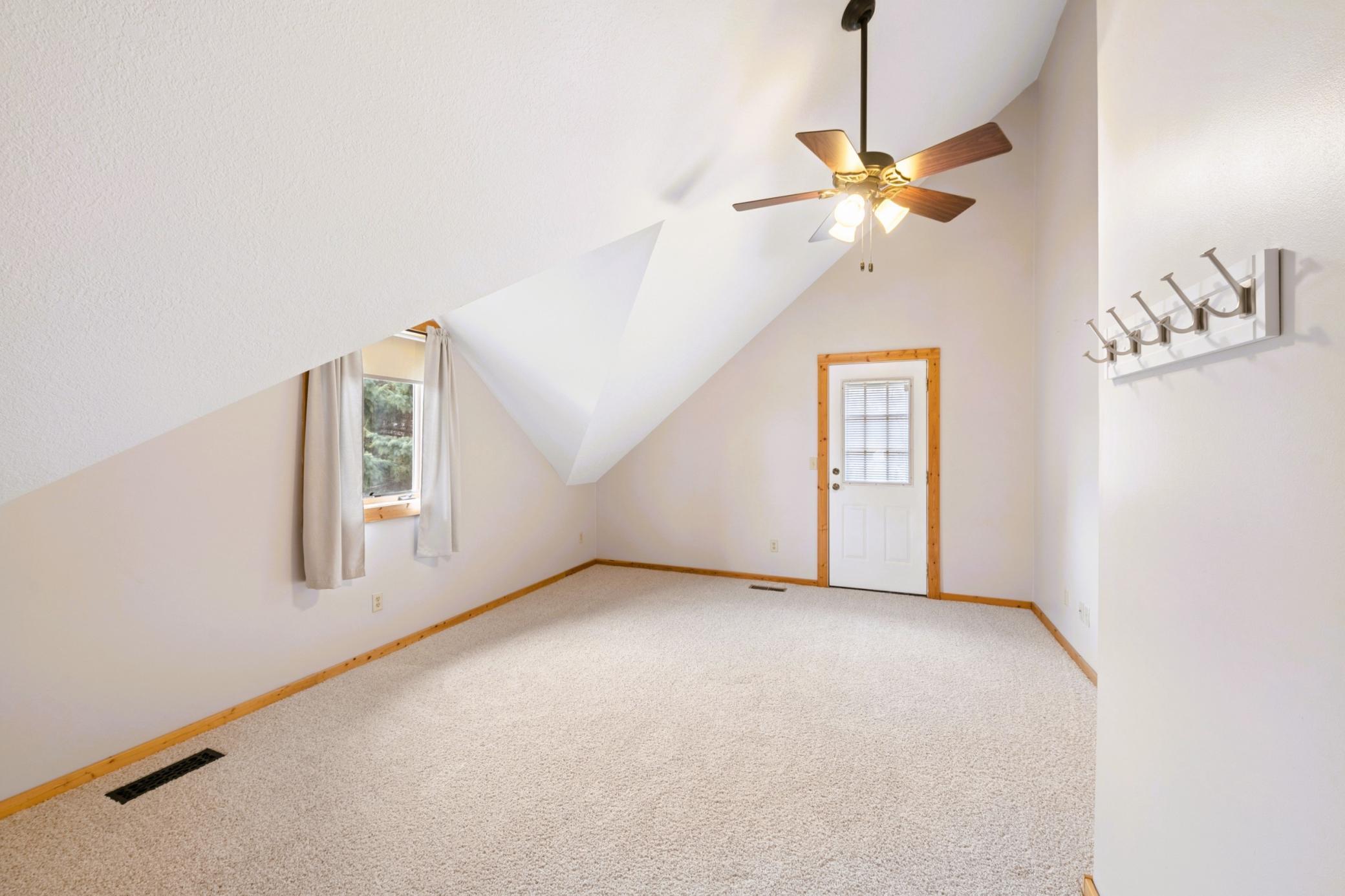 Upper level large bedroom 2 - lots of sleeping space and a walkout balcony.