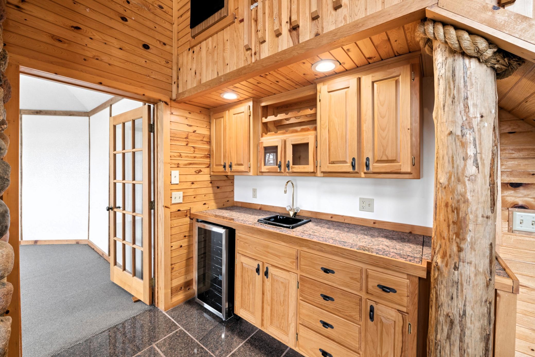 Built-in wet bar area with additional cupboard space.