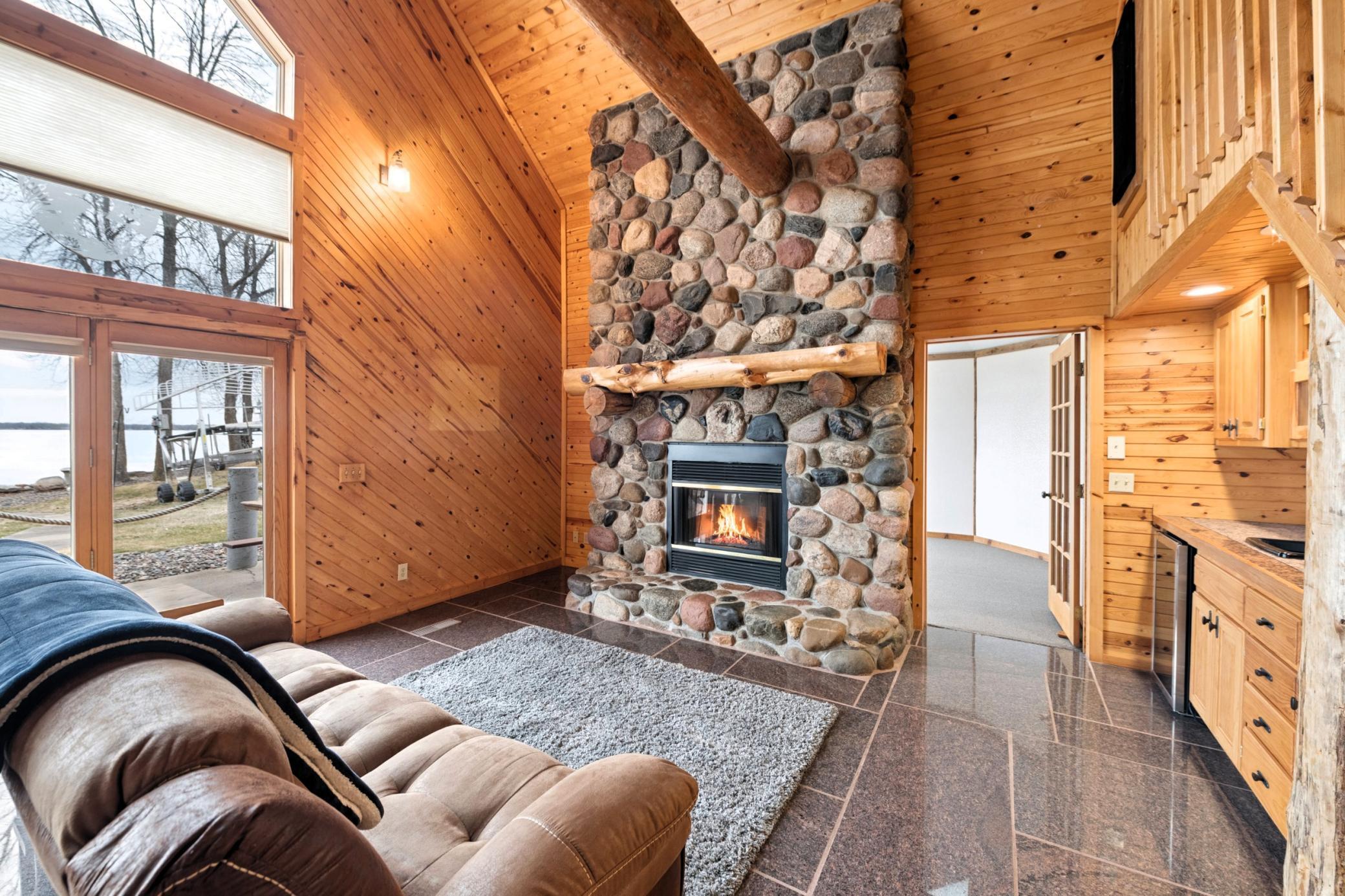 2-story stone gas fireplace.