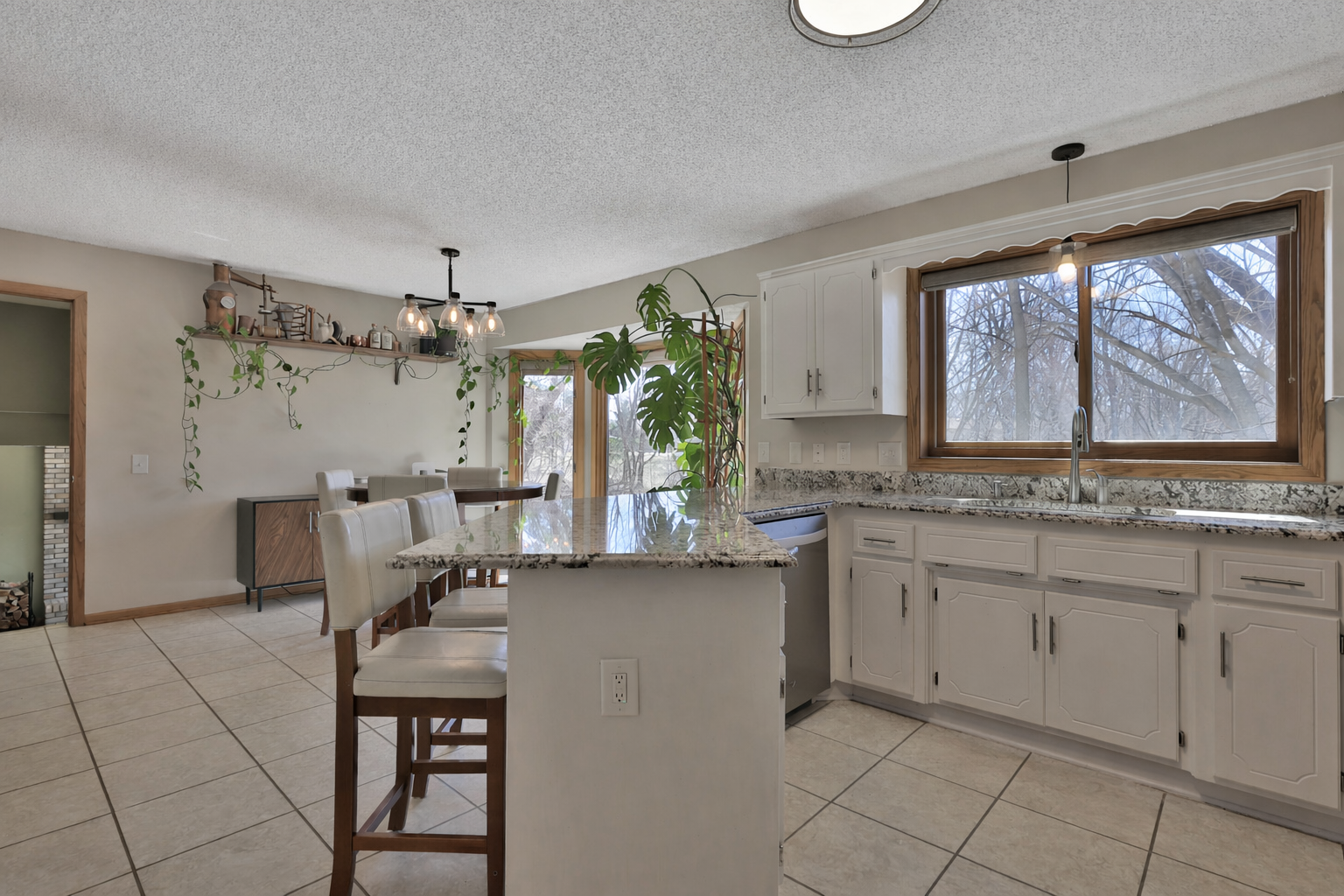 Dining and kitchen area right off of the living room and foyer.