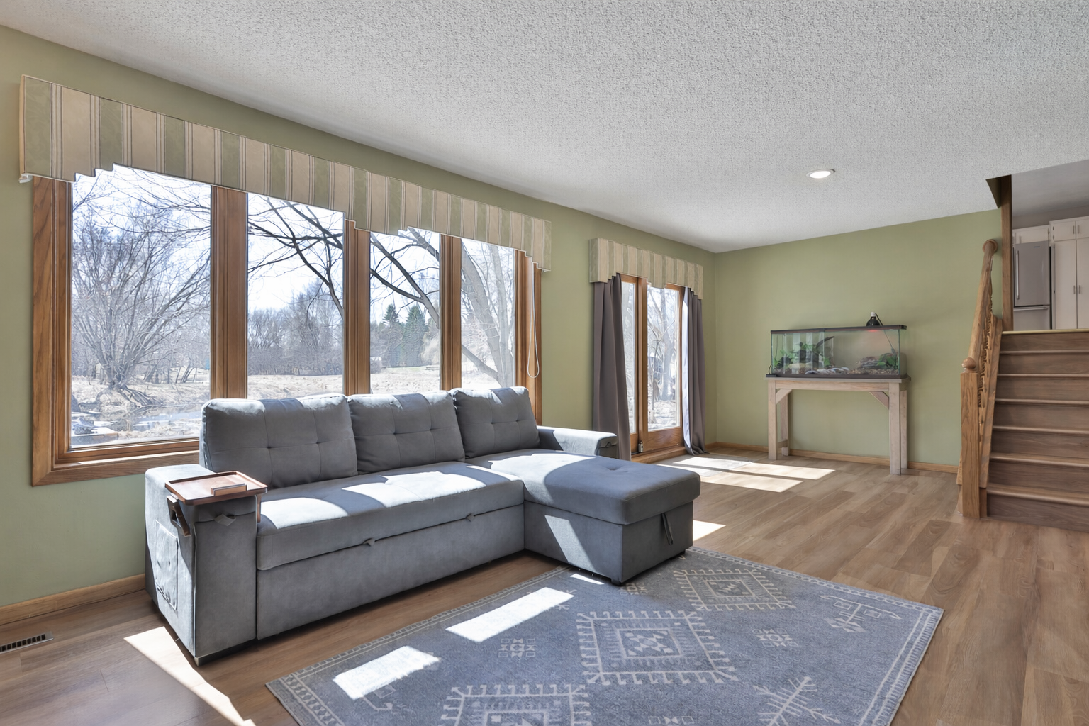 Huge windows and patio door walks out to enormous stamped concrete patio.