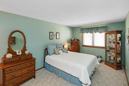 Primary bedroom with a walk-in closet and walk-thru bathroom.