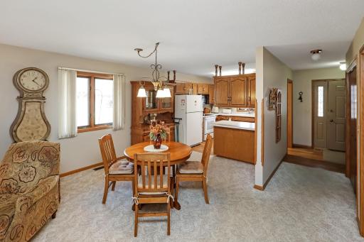 Open dining to kitchen area, near the front entry. (An additional storage/pantry/coat closet on the right, along with the laundry closet.)