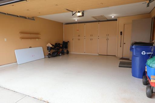 Finished 2 stall garage with epoxy floor and lots of additional storage up front.