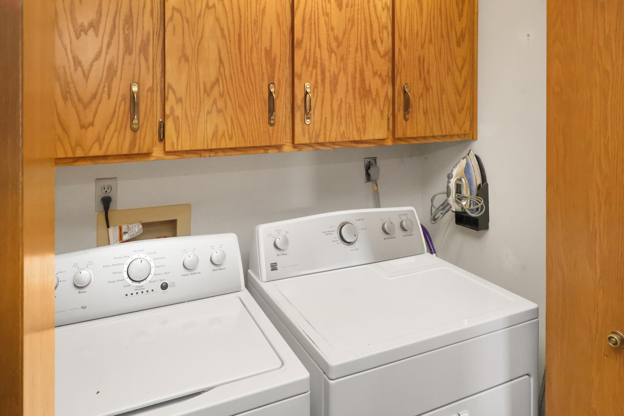 Laundry closet- washer and dryer to stay.