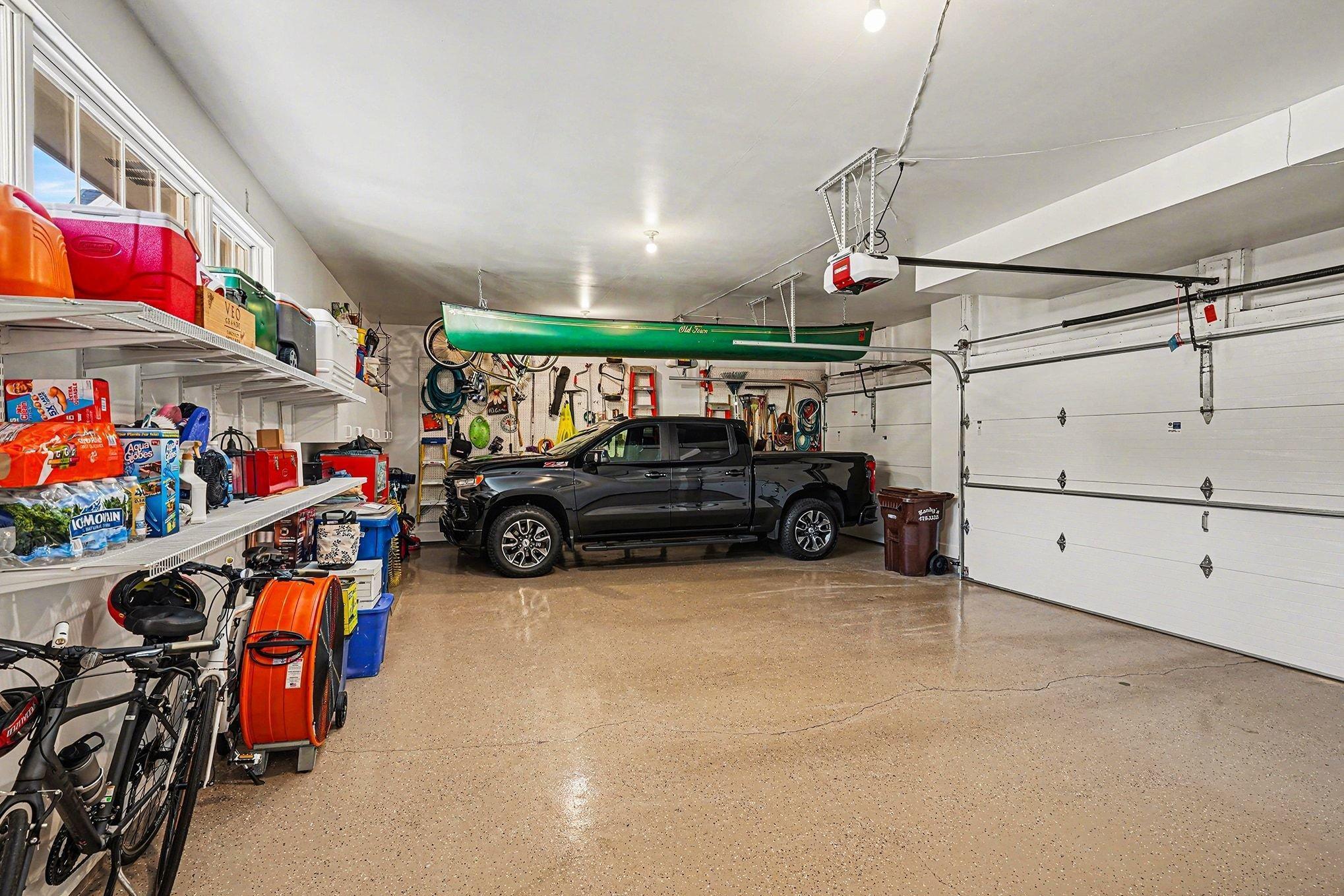 Oversized garage with deep 3rd stall and epoxy flooring