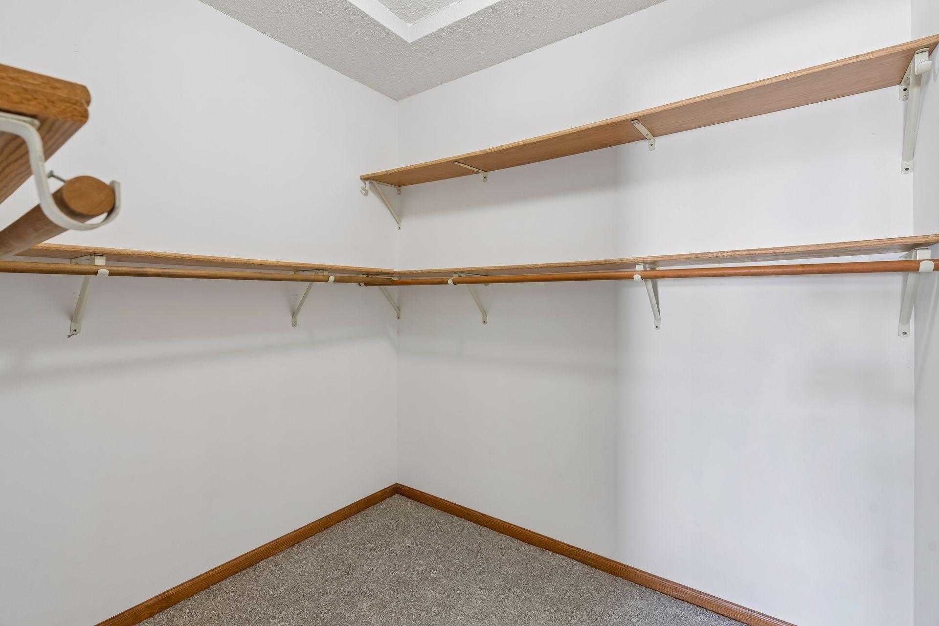 Primary bedroom walk in closet.