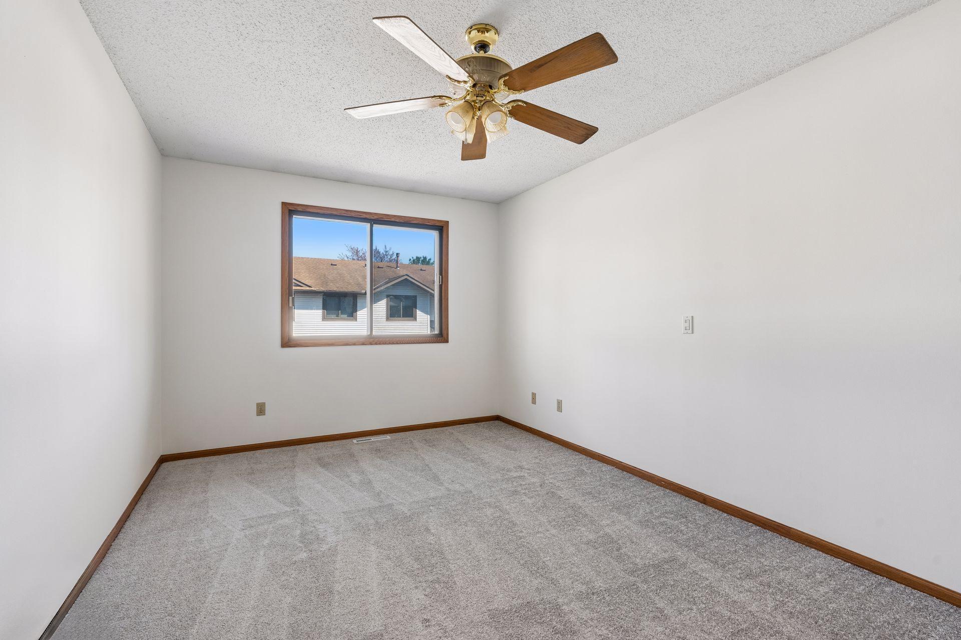 Primary bedroom has new carpet and fresh paint.