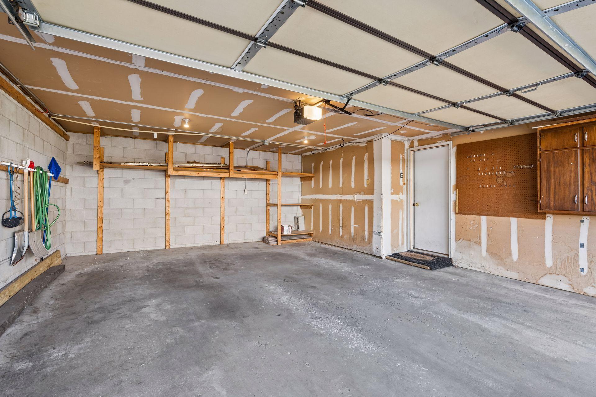 Spacious garage with plenty of storage.