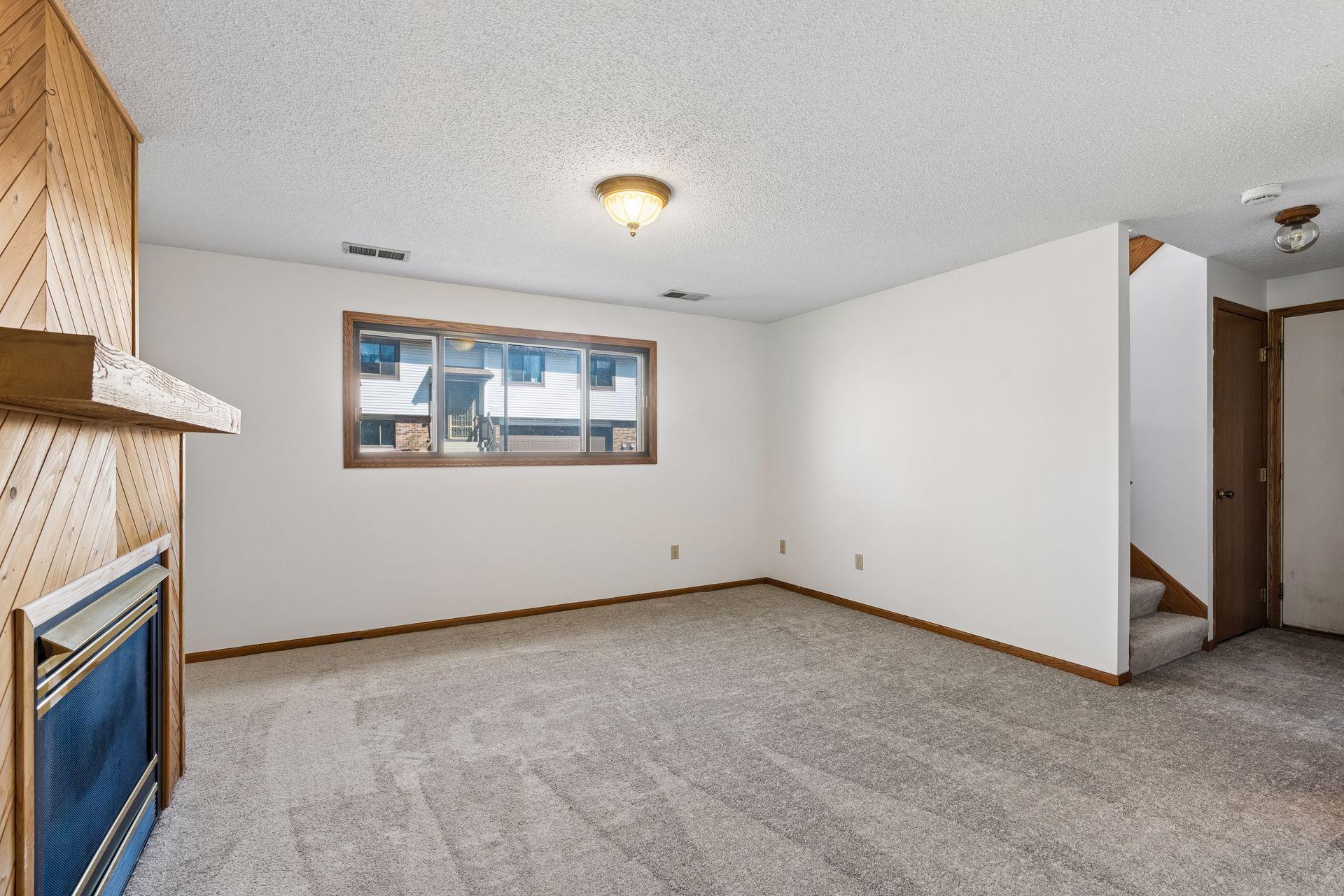 Lower level Family Room has fresh paint and new carpet.