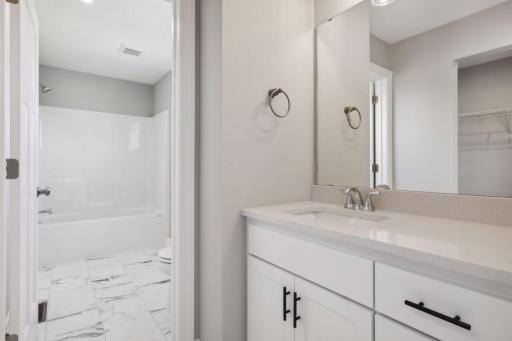 Jack-n-Jill bath on upper level. (Photo of a previously built Summit Floorplan)