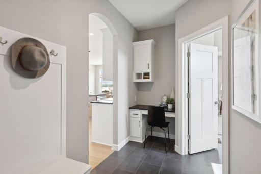 The spacious mud room helps your home stay organized. (Photo of a previously built Summit Floorplan)