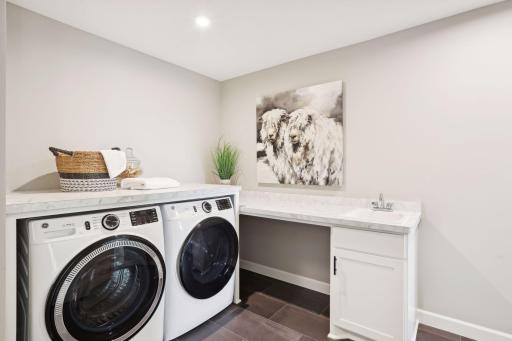Having the laundry room near all the upper level bedrooms makes laundry day a little bit easier. (Photo of a previously built Summit Floorplan)