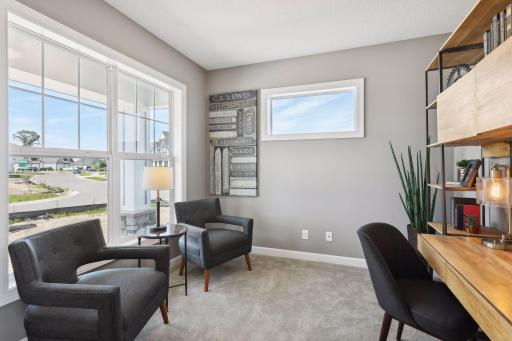 Just off the entry is a beautiful study, with views out the front of the home. (Photo of a previously built Summit Floorplan)