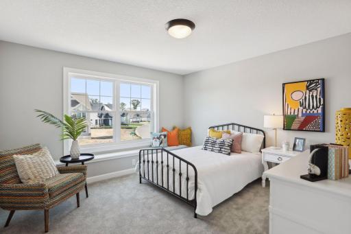 There are three additional bedrooms on the upper level as well as one on the lower level. (Photo of a previously built Summit Floorplan)