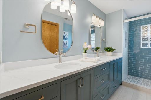 Updated 3/4 hallway bath with double vanities, walk in shower and lots of storage.