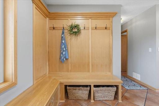 The drop zone that makes sense. Built-in storage, hooks, and the quiet dignity of a home that's thought of life being lived in it.