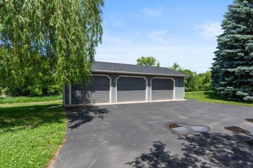 The additional 3-car detached garage and additional parking.