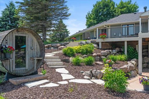 Deck, landscaping, sauna, and all the breathing room you've been looking for.