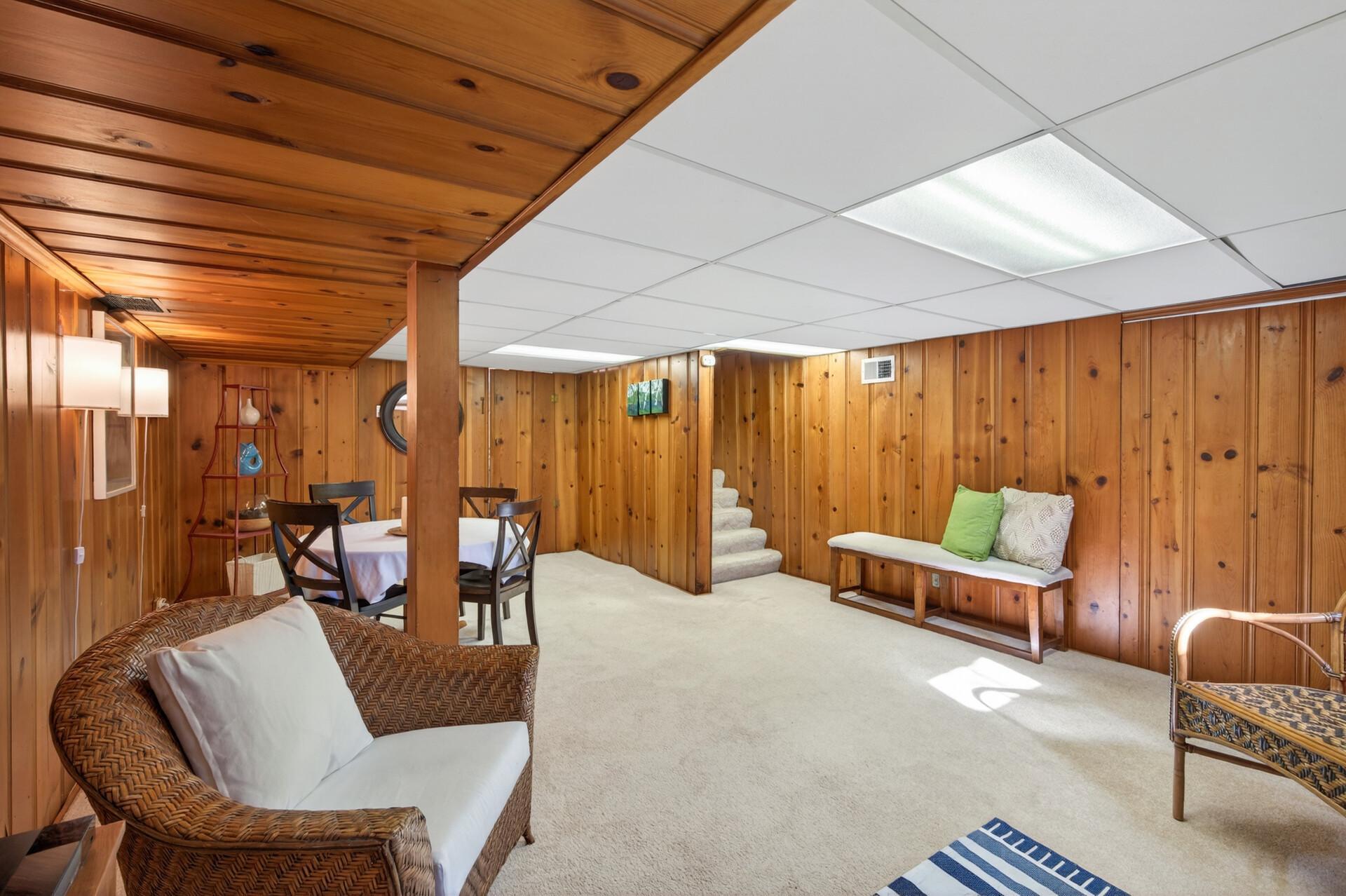 The knotty pine paneling makes it a cozy-feeling family room.