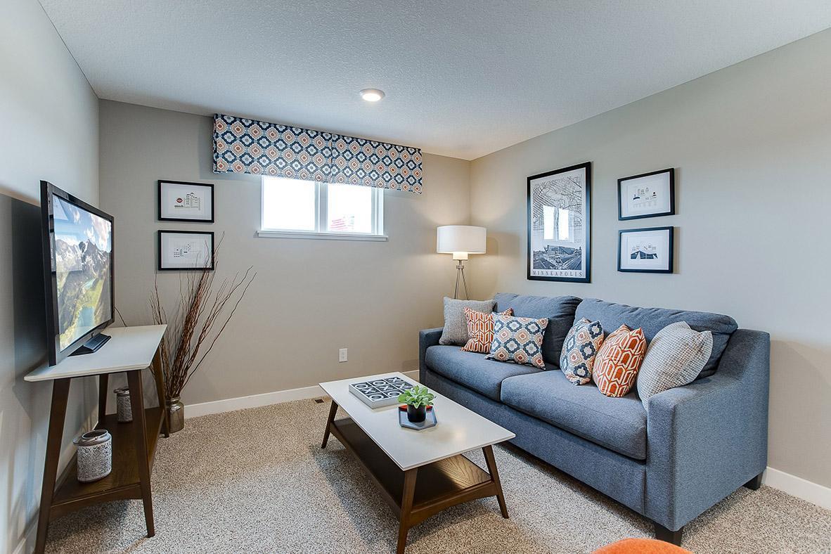 A top the staircase you will find the home's loft area, which offers more than 100 square feet of additional living space and located just steps away from each of the home's four upper level bedrooms! (Photo of model, colors are similar)