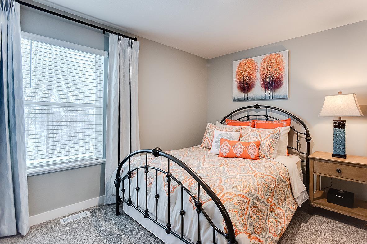 Each of the homes three additional bedrooms are also abundant in size! (Photo of model, colors are similar)