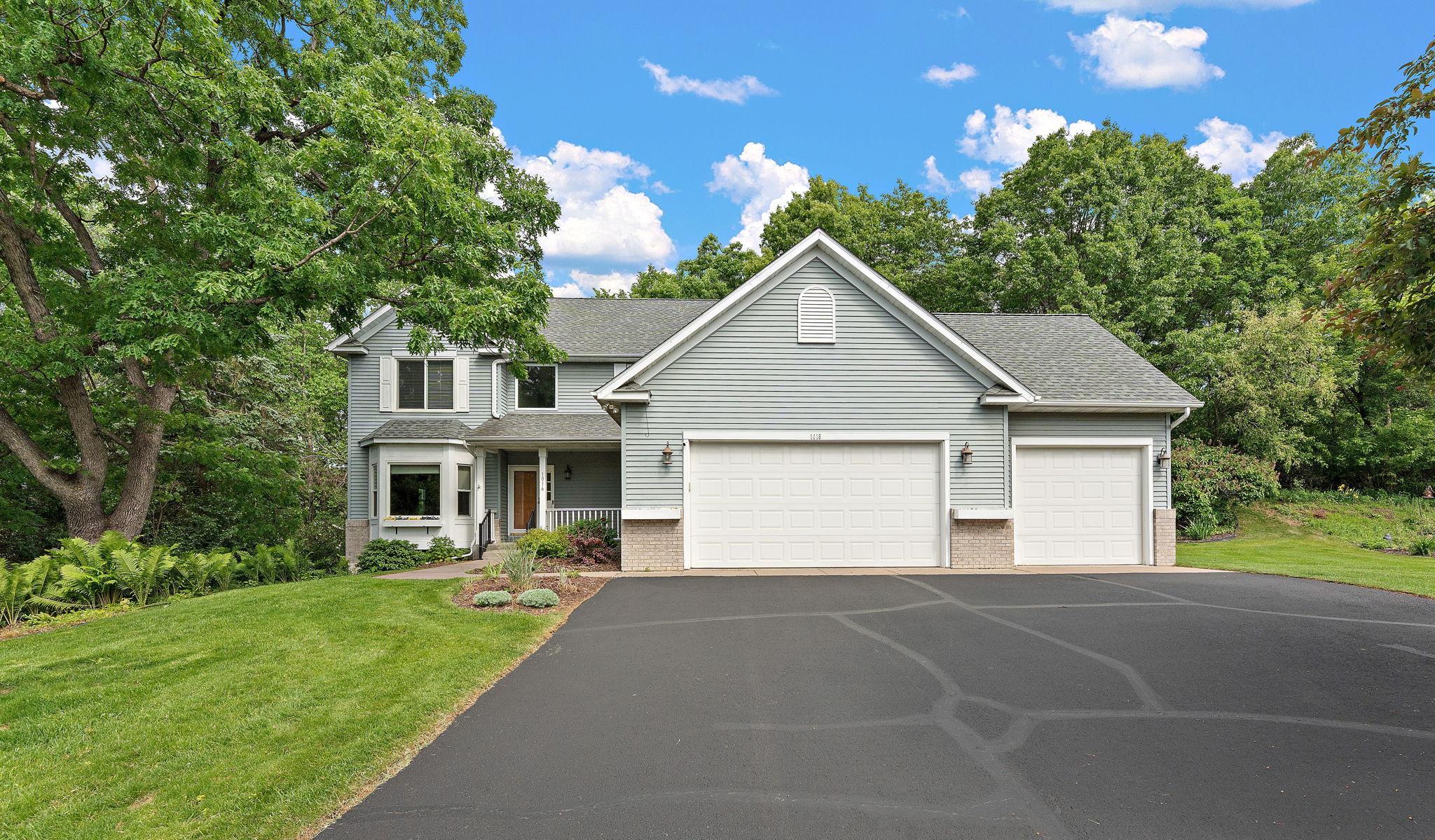 New sealcoated asphalt driveway!