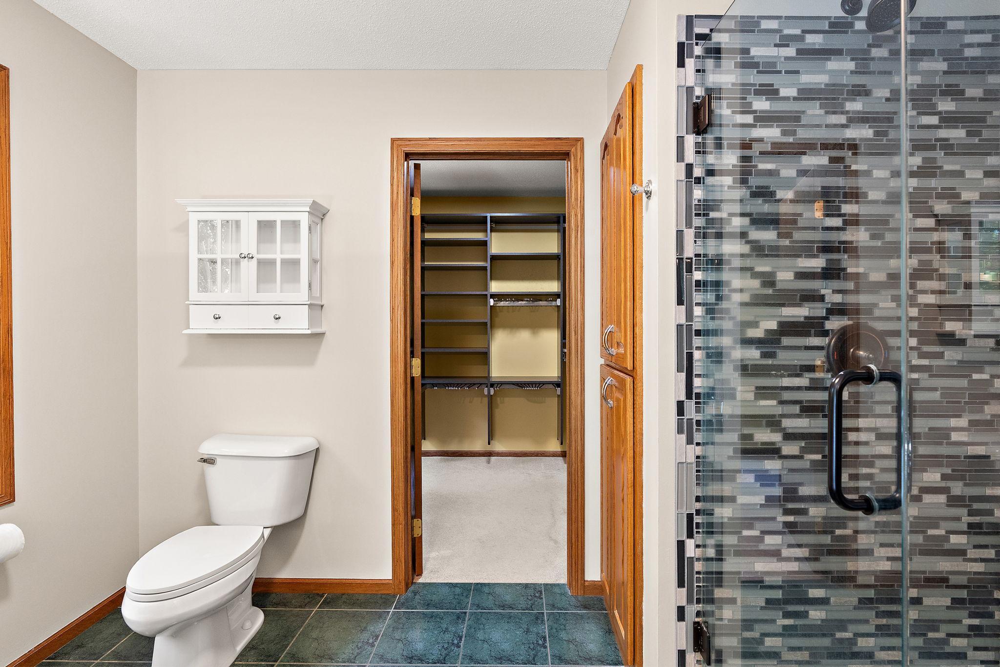 Primary bath has separate tub and updated walk-in shower