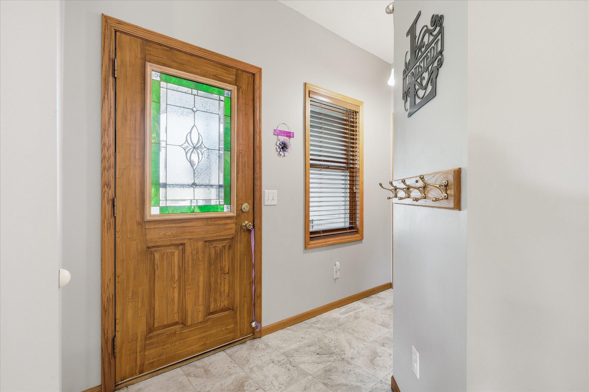 This welcoming entry creates a smooth transition into the spacious main living areas.