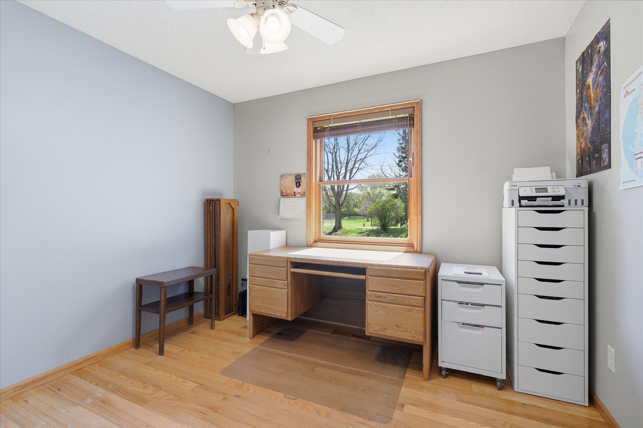 A large window fill the second bedroom with natural light while offering pleasant neighborhood views.